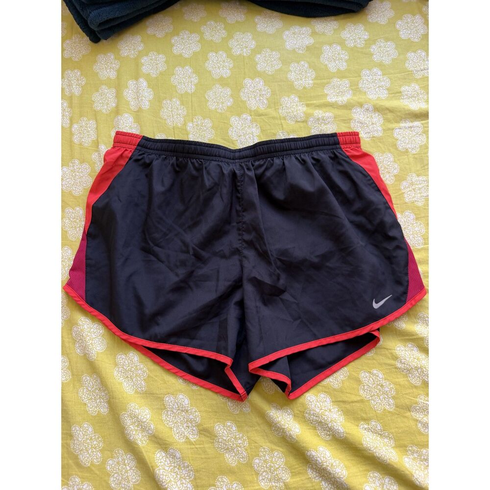 Nike shorts in black and orange size L